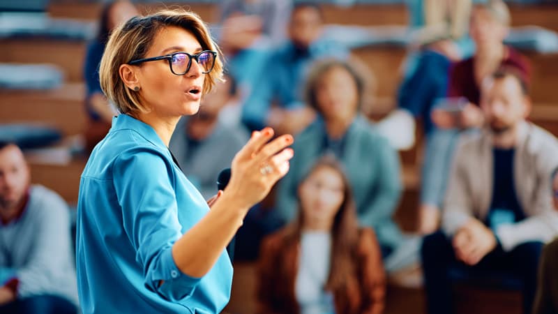 Female Presenting To The Group