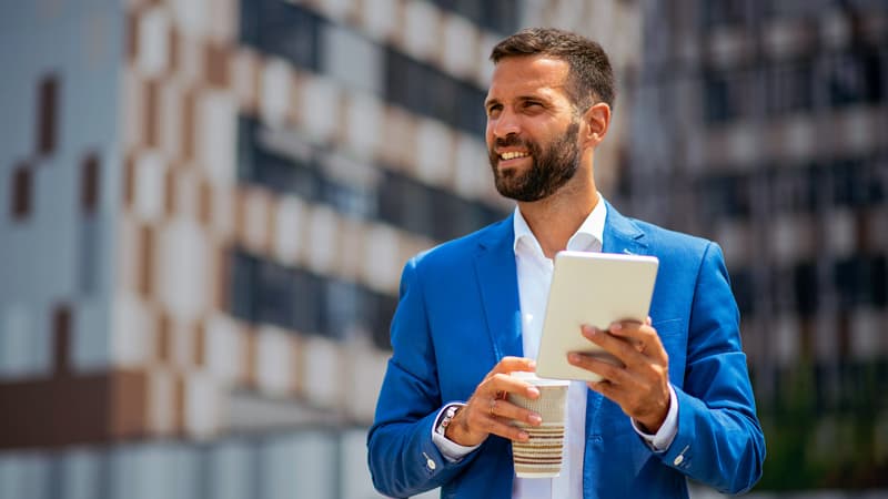 Male With Ipad And Coffee