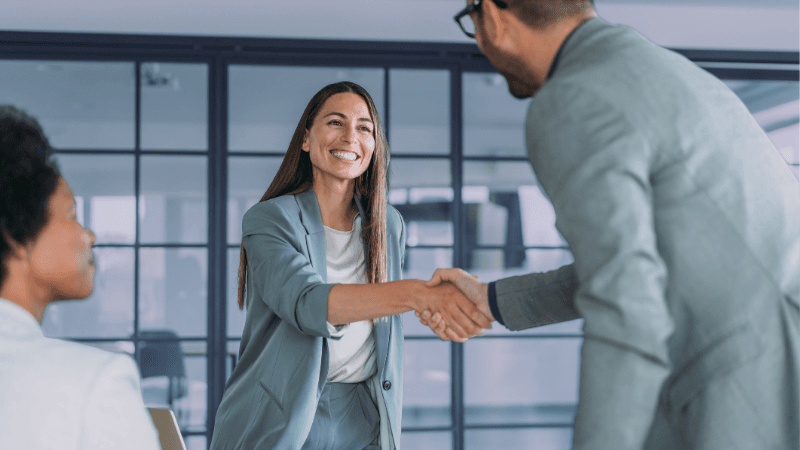 Professionals Shaking Hands in Job Interview